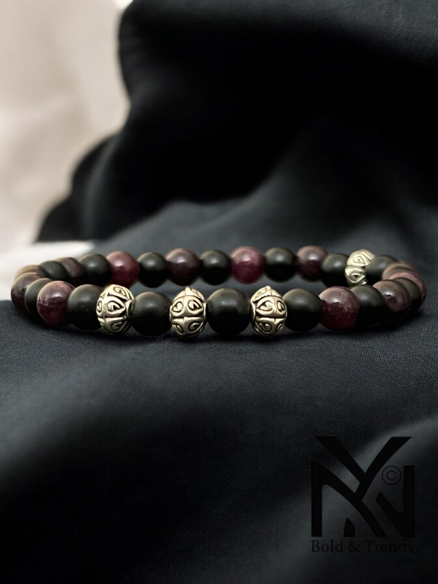 Soleil Rouge bracelet with vibrant red and orange gemstones, inspired by the warmth and energy of the sun